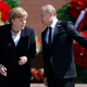 Putin and German chancellor Angela Merkel at Moscow’s Tomb of the Unknown Soldier in 2015.